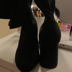 knee high heeled boots.